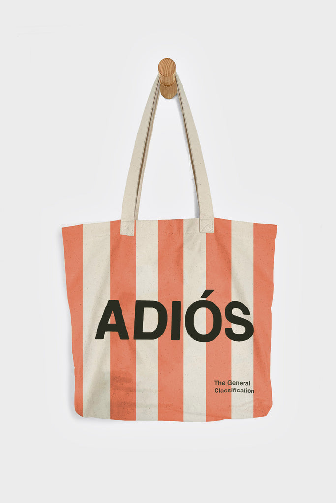 Striped tote bag with 'ADIÓS' text on a white background