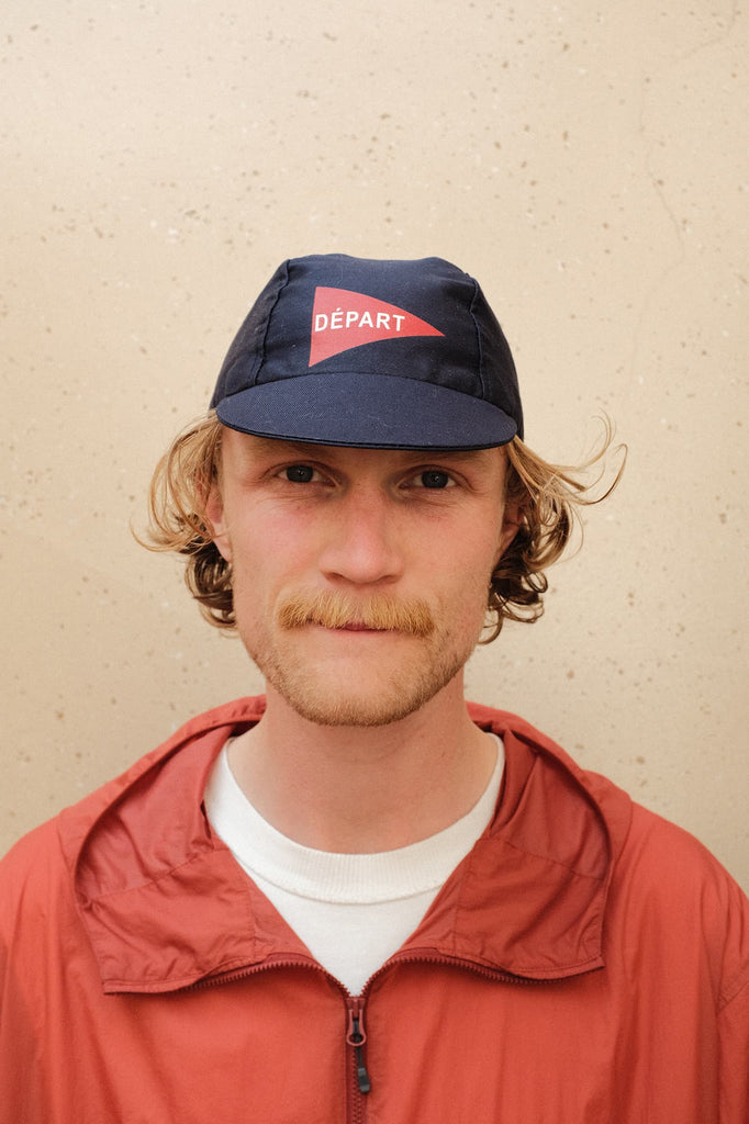 Depart Cycling Cap in Blue worn by a male model